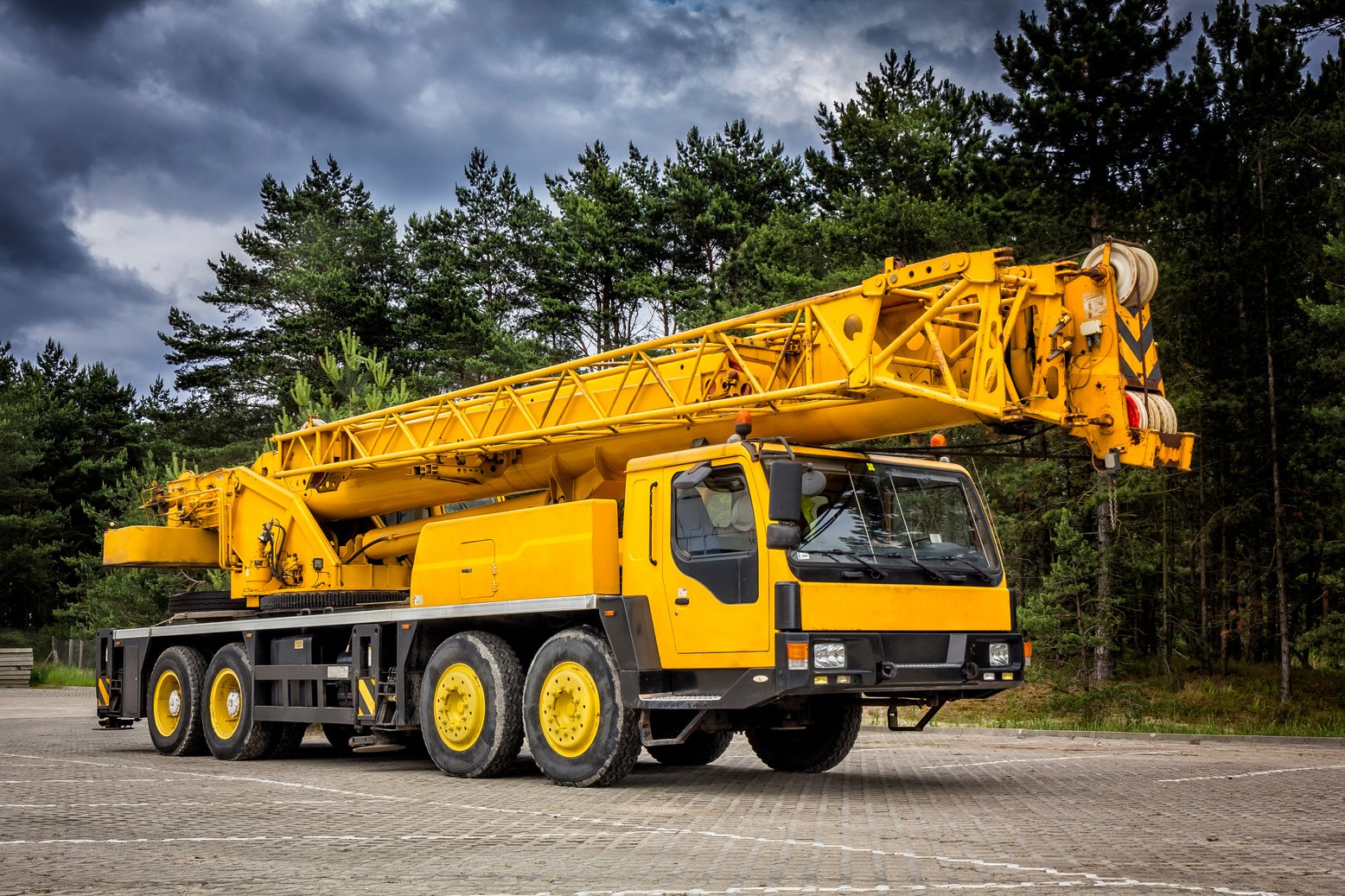 Yellow mobile crane in road construction